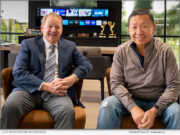 im Snyder, CEO of Tidemark Real Estate Services, poses with William Wang